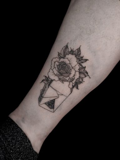 illustrative peony flower in chinese takeaway box on ankle / lower leg tattoo, done in Lörrach